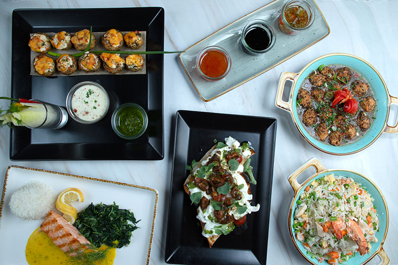 Verschiedene Gerichte des ENJOY Restaurant Frankfurt auf diversen Tellern